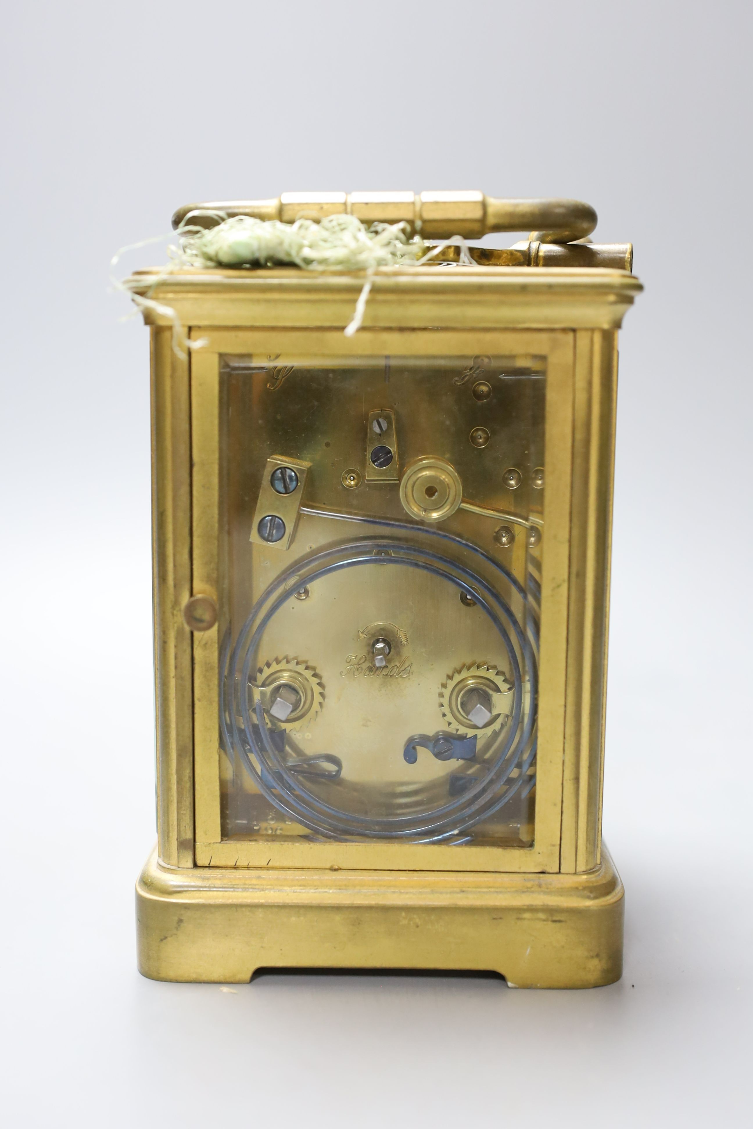 A leather cased brass carriage clock